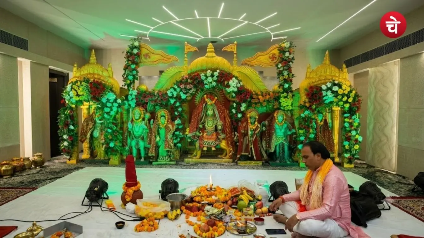 A priest performing worship rituals before the statue of Maharaja Agrasen